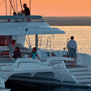 Lagoon 620 all-inclusive yacht charter at sunset